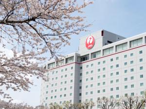 a building with a sign on top of it at Hotel Nikko Narita in Narita