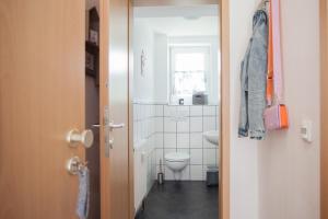 a small bathroom with a toilet and a window at Ferienwohnung Mia in Winterberg +37 photos