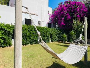 a hammock hanging from a pole in a yard at Can Mossènyer in San Antonio