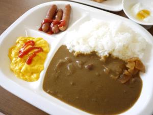 a plate of food with rice and other foods at Hotel Select Inn Shikoku Chuo in Shikokuchuo