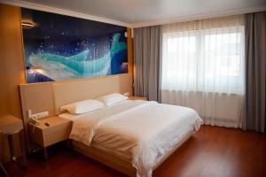 Voodi või voodid majutusasutuse Mr.Liao Hotel toas