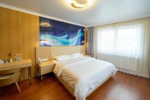 Voodi või voodid majutusasutuse Mr.Liao Hotel toas