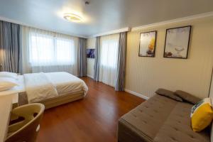 Voodi või voodid majutusasutuse Mr.Liao Hotel toas