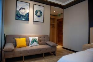 Voodi või voodid majutusasutuse Mr.Liao Hotel toas