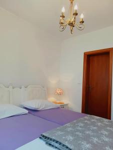 Postel nebo postele na pokoji v ubytování Apartments Vrisak