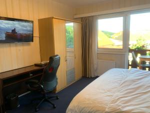 Postel nebo postele na pokoji v ubytování Hotel Austria