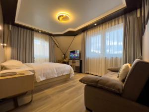 Voodi või voodid majutusasutuse Mr.Liao Hotel toas