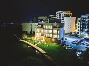 a view of a city at night with buildings at Poeme Mamaia Retreat in Mamaia