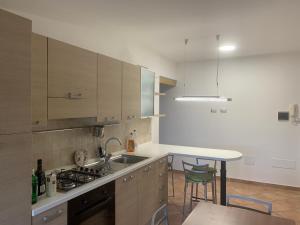 a kitchen with a sink and a stove top oven at Oasi del patricano, Patrica in Patrica