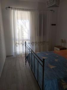 Postel nebo postele na pokoji v ubytování Villetta Gallurese + 12 fotografií