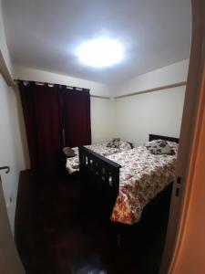 מיטה או מיטות בחדר ב-Departamento ciudad de Mendoza