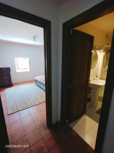 a door leading to a bathroom with a bedroom at IL BORGO DI ROCCA CALASCIO in Calascio +68 photos