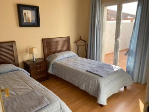Łóżko lub łóżka w pokoju w obiekcie Villa Los Altos, La Herradura, Almuñecar