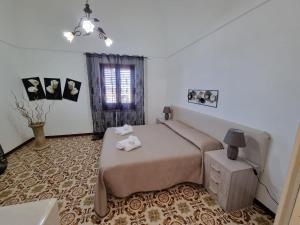 Posteľ alebo postele v izbe v ubytovaní Dammuso Stelle e Luna