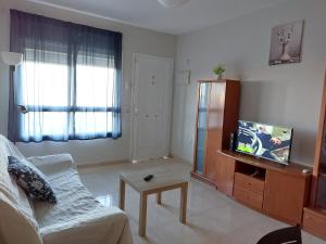 Televízia a/alebo spoločenská miestnosť v ubytovaní Dúplex centrico, luminosos y bonitas vistas.