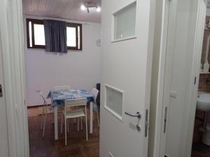 a room with a table and a table and a window at Sea House Kamaraton in Marina di Camerota +80 photos