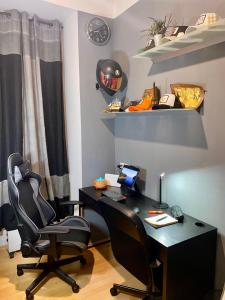an office with a desk and two chairs at Mini Smart Studio - Self Check-in in Graz