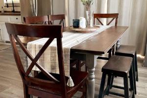 a dining room table with two chairs and a wooden table at The Lake House in Crestline