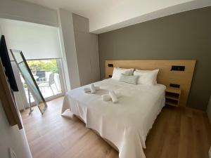 Postel nebo postele na pokoji v ubytování Fospitality Varkiza