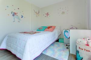 A bed or beds in a room at Azalea ii
