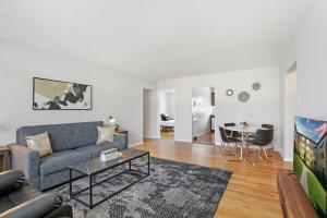 a living room with a couch and a table at 3BR Homey with Comfy Living Room Apartment - Bell 2G in Chicago