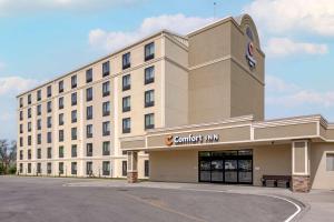 a large building with a sign on the front of it at Comfort Inn The Pointe in Niagara Falls