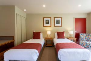 Te Weheka Boutique Hotel客房内的一张或多张床位