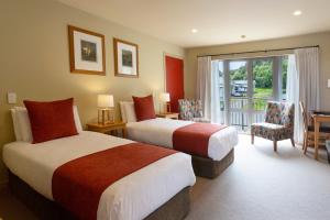 Te Weheka Boutique Hotel客房内的一张或多张床位