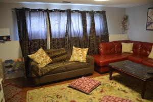 a living room with a couch and a table at Aasra Home in Kelowna