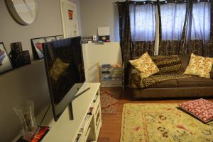 a living room with a couch and a table at Aasra Home in Kelowna