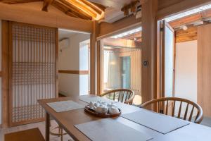 a dining room with a table and chairs at Luxury hanok with private bathtub - SW10 in Seoul