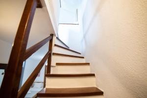 a staircase in a house with a window at Perfect House in Pefkochori +13 photos