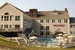 a large building with a swimming pool in front of it at Disney Magic at Jiminy Mountain in Hancock