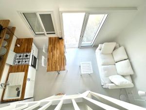 a small kitchen with white appliances and a window at Bungalow for 6 people maximum at Saint Barth in Gustavia