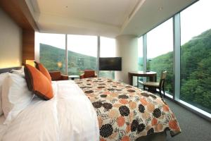 High1 Grand Hotel Convention Tower客房内的一张或多张床位