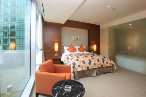 High1 Grand Hotel Convention Tower客房内的一张或多张床位