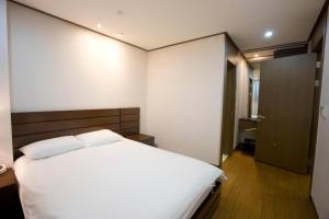 Postel nebo postele na pokoji v ubytování High1 Condominium