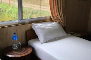 Llit o llits en una habitació de Hotel Mount Paradise