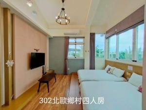 Postel nebo postele na pokoji v ubytování 小雅民宿 Oo自助入住旅店oO