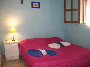 Una cama o camas en una habitación de Hosteria Aura Azul (ex Ser Azul)