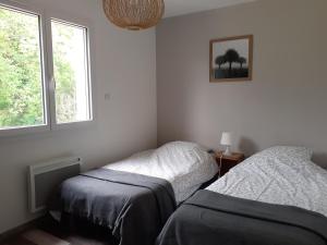Llit o llits en una habitació de Gîte en pleine nature, A la douceur des Chênes