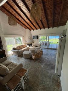 a large living room with couches and a table at Ήλιος Villa in Ktima Gerostathi in Polykhrono +27 photos