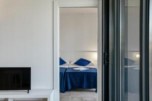 Postel nebo postele na pokoji v ubytování Pelosa Apartment