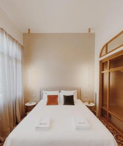 Postel nebo postele na pokoji v ubytování Kale Kapi City Living