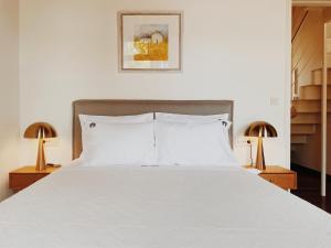 Postel nebo postele na pokoji v ubytování Kale Kapi City Living