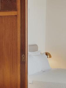 Postel nebo postele na pokoji v ubytování Kale Kapi City Living