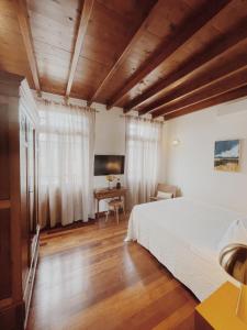 Postel nebo postele na pokoji v ubytování Kale Kapi City Living