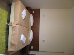 Ένα ή περισσότερα κρεβάτια σε δωμάτιο στο Ξενοδοχείο Άλμα