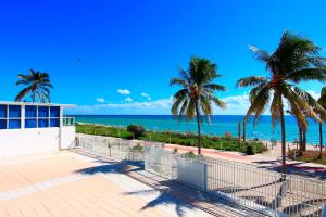 a view of the ocean from the balcony of a house at Miami Beach Apartments by MiaRentals in Miami Beach