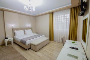 Postel nebo postele na pokoji v ubytování Christi's Hotel Borova